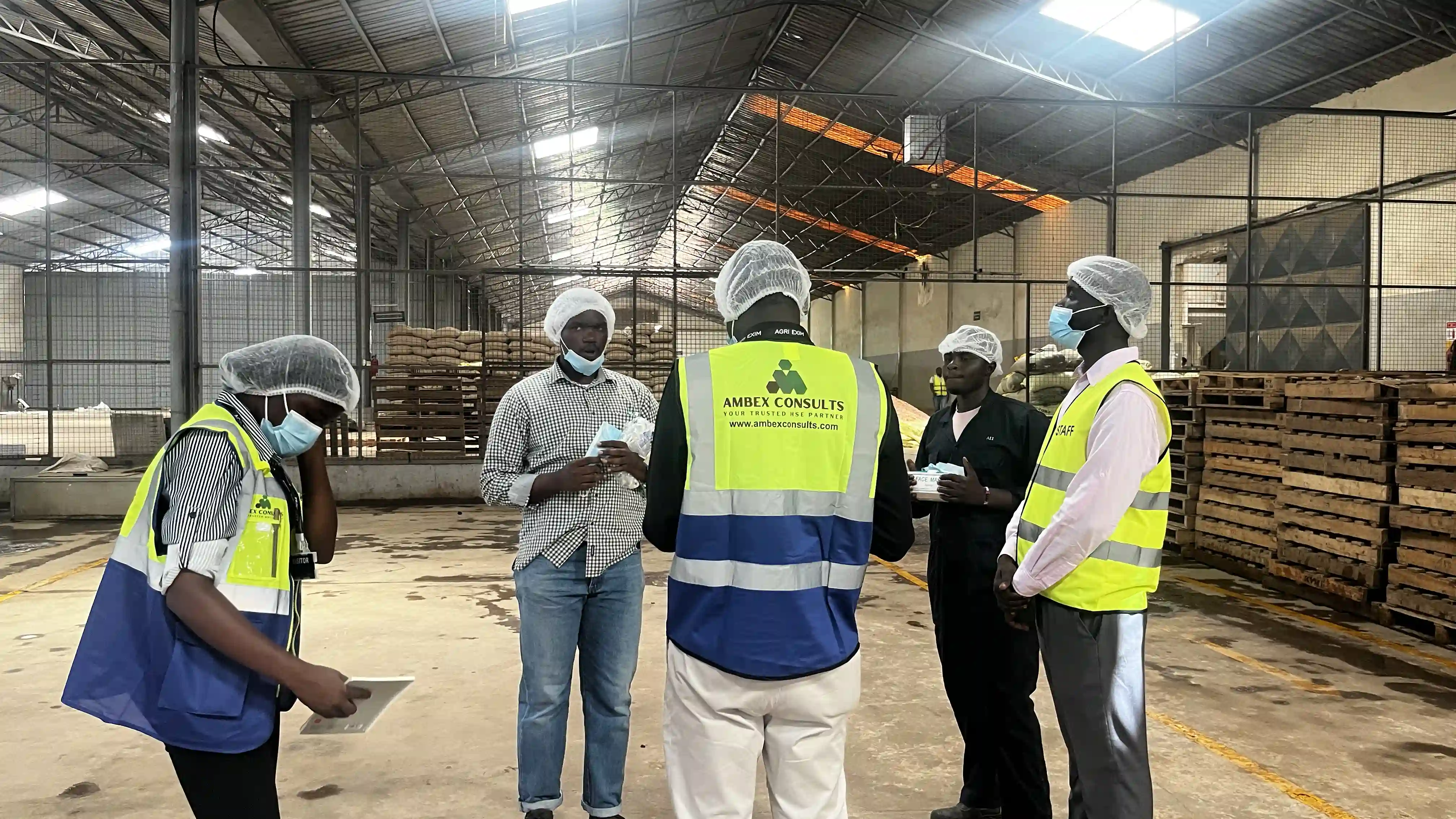 Workers in protective equipment on an industrial site